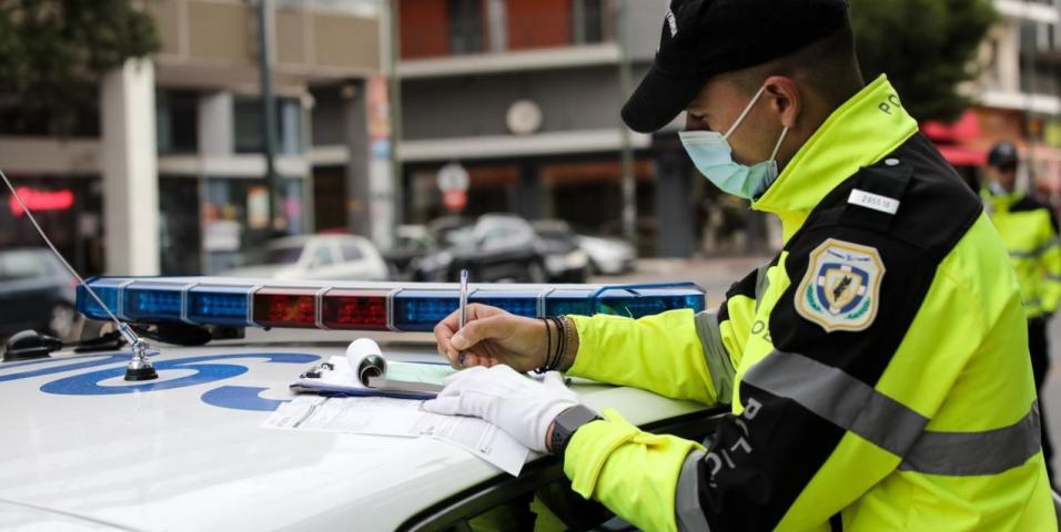 Traffic Police fine for helmet on car driver