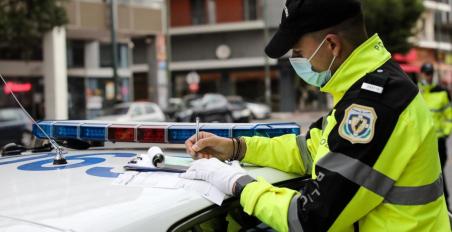 Traffic Police fine for helmet on car driver