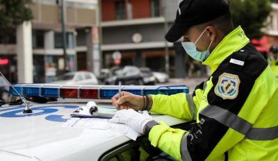 Traffic Police fine for helmet on car driver